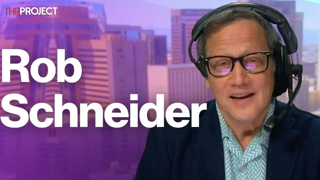 Why Rob Schneider Is Wearing The Biggest Headset In The World